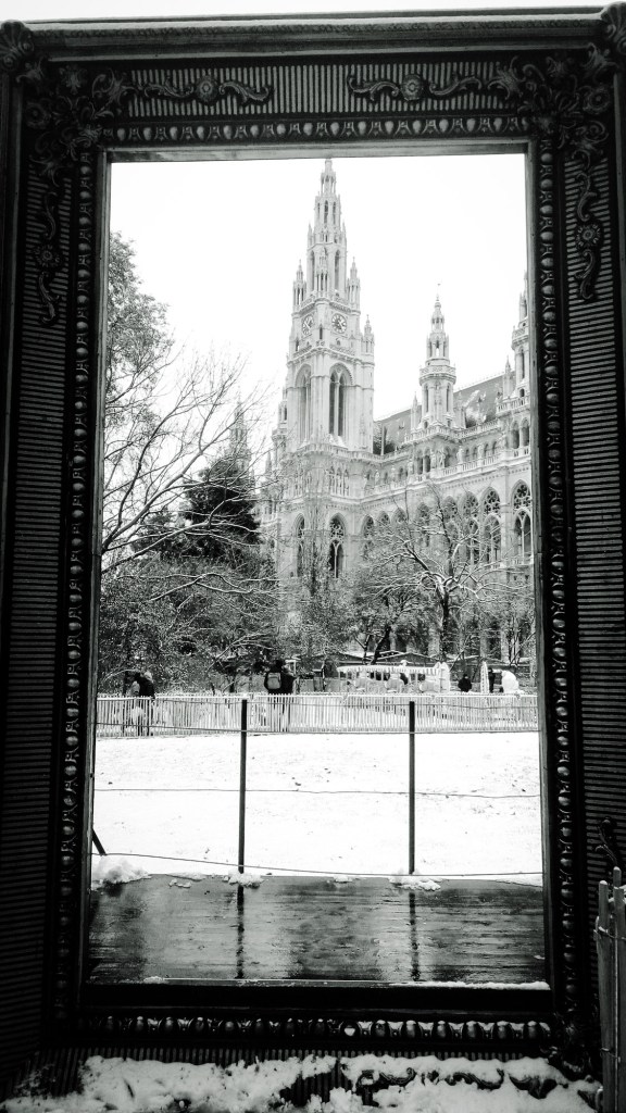 Urban photo - Vienna, Austria. 'Viennese Dream Christmas Market, 2.' This giant pictureframe was set up for selfies, but I thought Vienna's City Hall deserved a selfie of its own. sketchbookexplorer.com @davidasutton @sketchbookexplorer Facebook.com/davidanthonysutton #photograph #b&w #vienna #travel #travelblog #viennachristmas