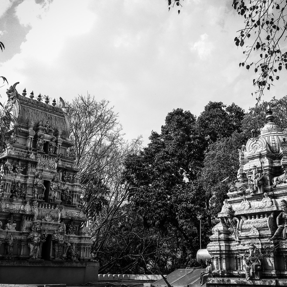 Urban photo art – Bull Temple Road, Basavanagudi, Bengaluru, Karnataka, India. ‘Dodda Ganesha Temple.’ Frequented by Bollywood stars, before films start rolling, the temple played a part in the Anglo Mysore War of 1791. Plans for the war were set out within the temple's grounds. sketchbookexplorer.com @davidasutton @sketchbookexplorer Facebook.com/davidanthonysutton #photograph #photography #blackandwhite #bangaluru #karnataka #temple #hindutemple #bulltemplebengaluru #hindu #travel #travelblog #india
